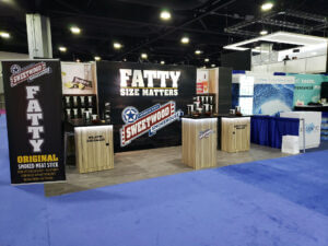 A large, rectangular sign displaying the word "FATTY" in bold letters, measuring 10x20 inches.