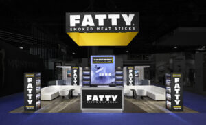 20x30 Custom trade show booth for FATTY meat sticks at NACS 2024. Displays striking features, graphics and hanging sign.