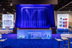 Large Virginia Transformer water feature displayed in their booth, featuring promotional messaging for attendees.