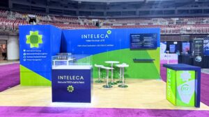 Inteleca's 10x20 trade show booth with a custom logo and pedestals designed for effective product showcasing.