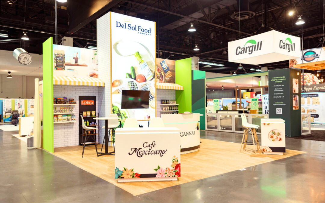 Del Sol Food Company trade show booth rental at Expo West with branded counters, backlit tower and product displays