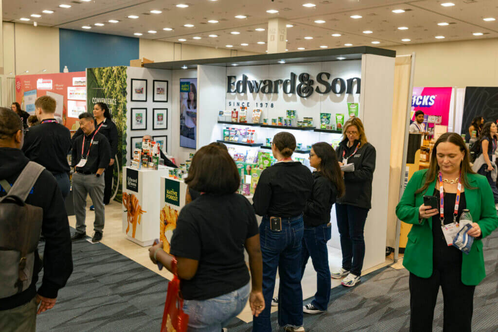 Custom trade show booth for Edward & Sons with product displays and seating area