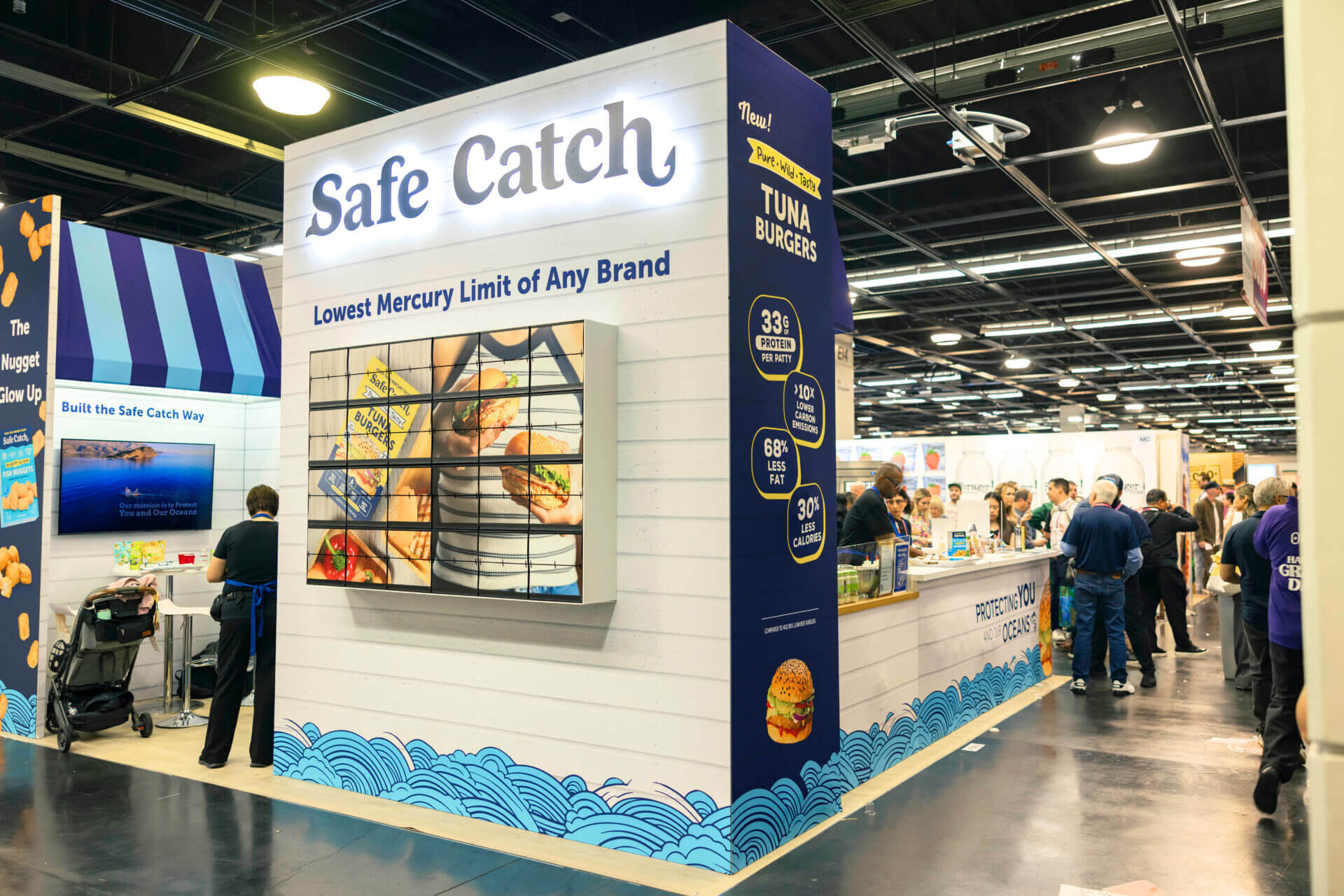 Custom picture flap wall at Safe Catch exhibit booth